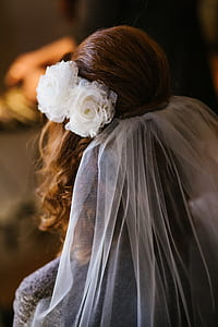 woman wearing white floral headdress thumbnail