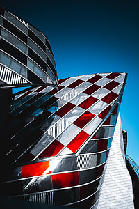 landscape photography of black, white, and red building thumbnail