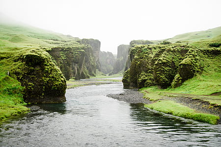 body of water between mountains thumbnail