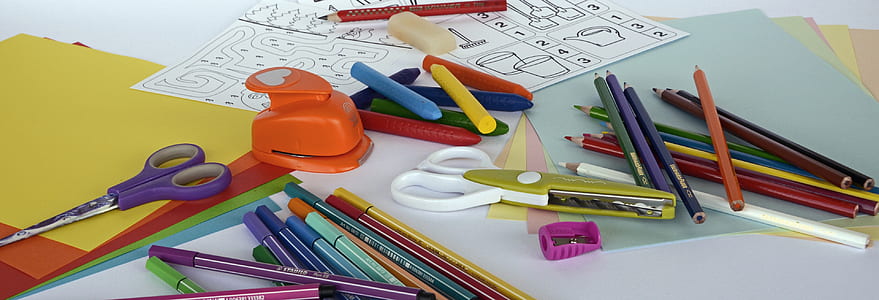 scissors and pencils on top of papers thumbnail