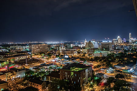aerial photography of high-rise buildings during nighttime thumbnail