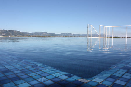 infinity pool with white metal railings thumbnail