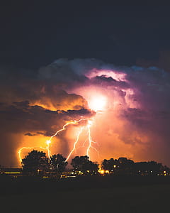 silhouette of trees near lightning thumbnail