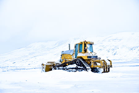 yellow bulldozer on snow thumbnail