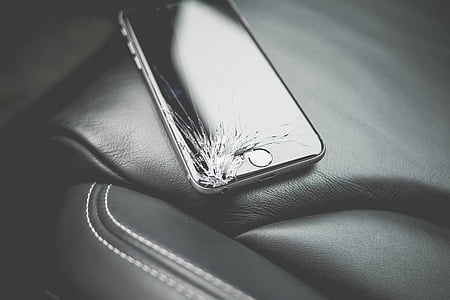 cracked space gray iPhone 6 on black leather textile thumbnail