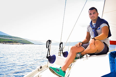 man sitting on boat deck thumbnail