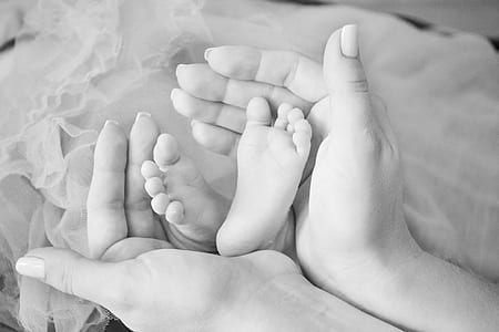 person holding baby's feet thumbnail