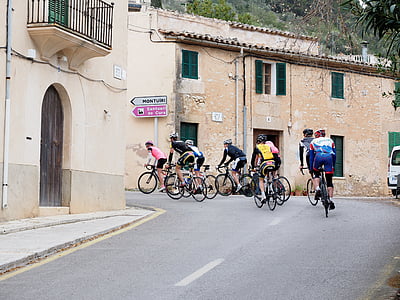 cyclists on road during daytime thumbnail
