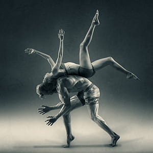 photography of woman on man back doing exhibition thumbnail