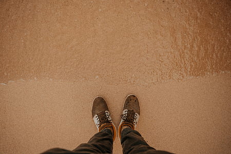 person wearing brown-and-white shoes thumbnail