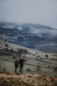 two women taking photos thumbnail