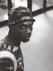 Monochrome Photo of a Man Wearing Camouflage Shirt thumbnail