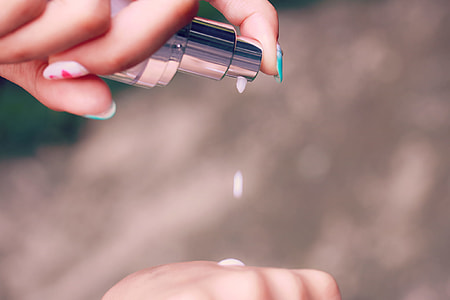 person holding product container thumbnail