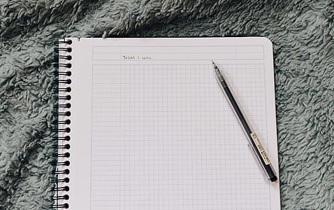 black click pen on grid notebook thumbnail