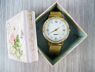 round gold-colored analog watch with link bracelet thumbnail