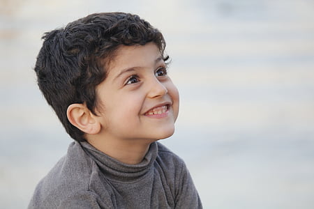 selective focus photography of a smiling kid thumbnail