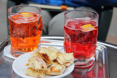 bread on plate and two cups filled with beverages thumbnail