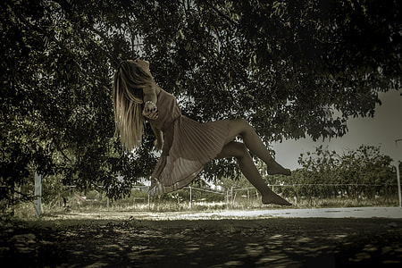woman wearing dress jumpshot during daytime thumbnail