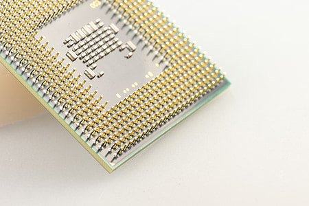 gold-colored computer processor unit on white surface thumbnail