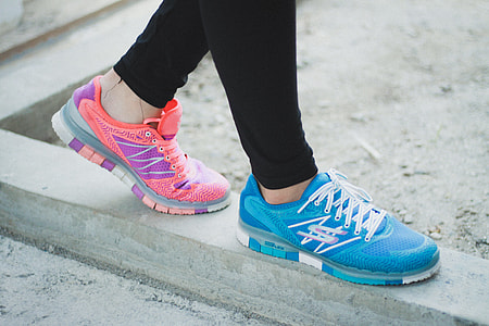 person wearing blue and pink athletic shoes thumbnail