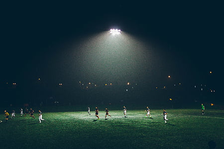 people on grass field at nighttime thumbnail