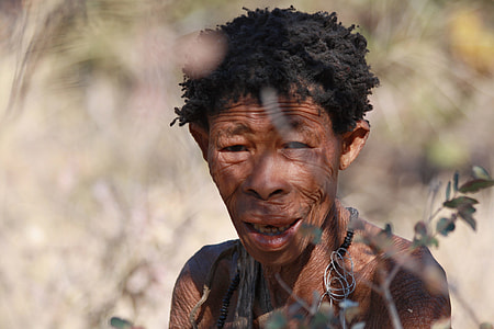 selective focus photography of man behind plant thumbnail