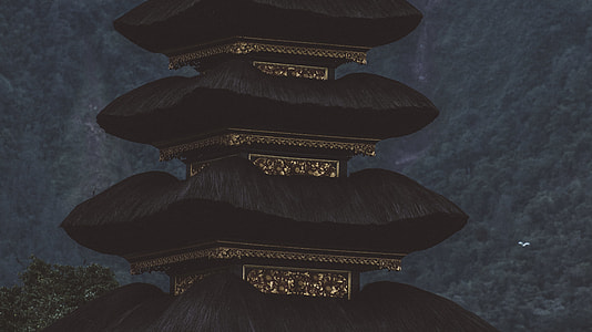black and gold house near mountain thumbnail