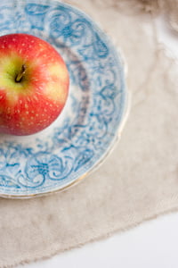 honeycrisp apple on white and blue plate thumbnail