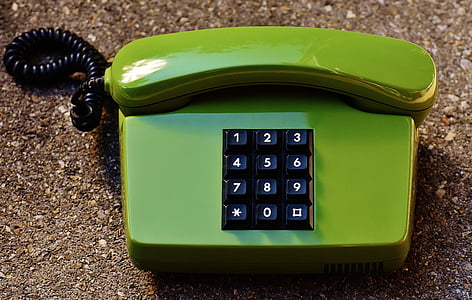green telephone on gravel thumbnail