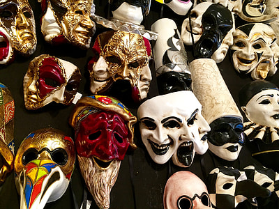 assort-color face masks mounted on wall thumbnail