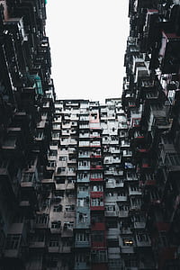 low angle photo of assorted-color high rise buildings during daytime thumbnail