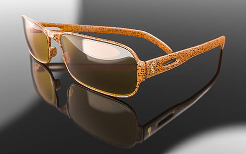 brown framed sunglasses on black surface thumbnail