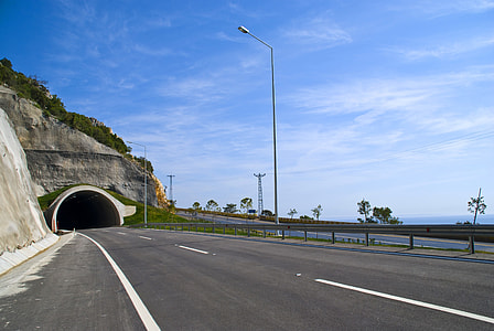 road near body of water thumbnail