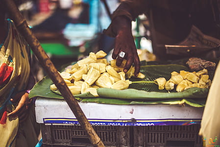 sliced bananas on green banana leaf thumbnail