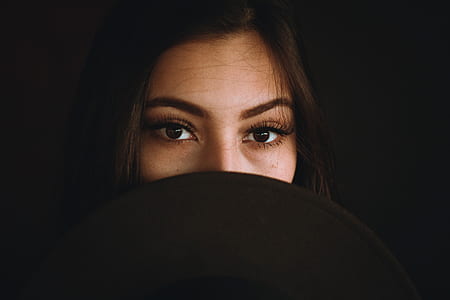 woman face covering mouth thumbnail