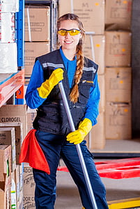 woman in blue vest wearing yellow gloves thumbnail