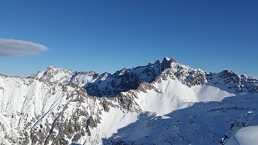 snow capped mountains at daytime thumbnail