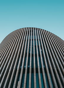 low angle photography of gray high-rise building thumbnail