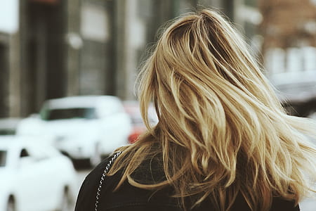 blonde haired woman wearing black top thumbnail