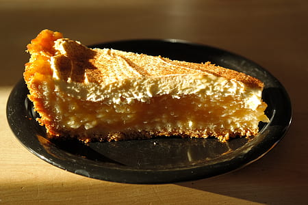 sliced of cake on round black plate thumbnail