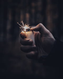 person holding white disposable lighter thumbnail
