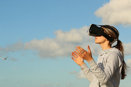 woman wearing black and white VR goggles thumbnail