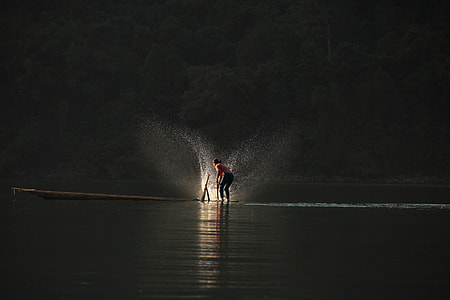 person standing on top of the boat thumbnail