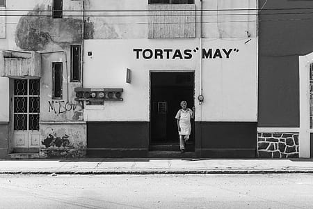 man standing outside the building thumbnail