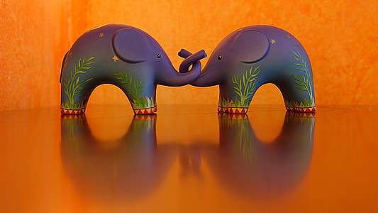 two purple elephant figurines thumbnail