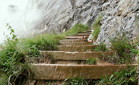 brown stone staircase on side of mountain during daytime thumbnail