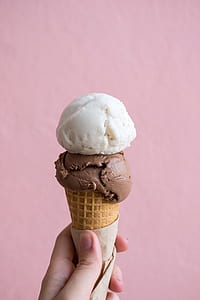 person holding cone with ice cream thumbnail