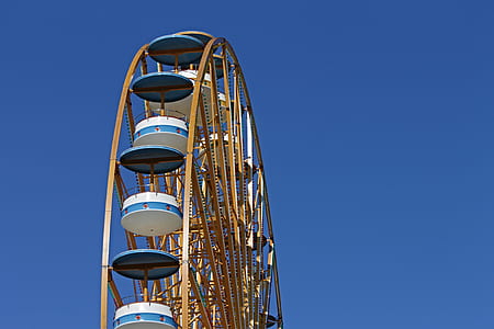 low-angle photo of ferris wheel under clear blue sky thumbnail