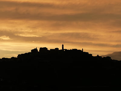silhouette photo of buildings during golden hour thumbnail