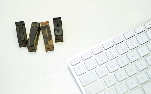 brown wooden cubes near Magic Keyboard thumbnail
